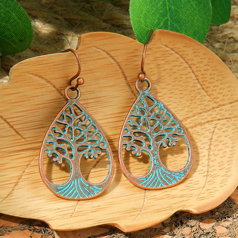 Intricate blue oxidised Tree of Life drop earring with antique finish - close-up detail | Zuzu's Trove
