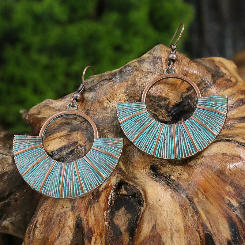Oxidised blue patina fan dangle earrings with sunburst design - front view | Zuzu's Trove