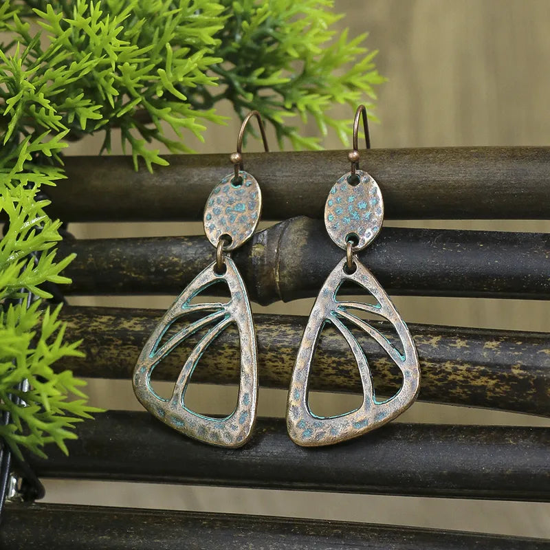 Long oxidised dangle earrings with bohemian abstract design and blue patina - Full view | Zuzu's Trove