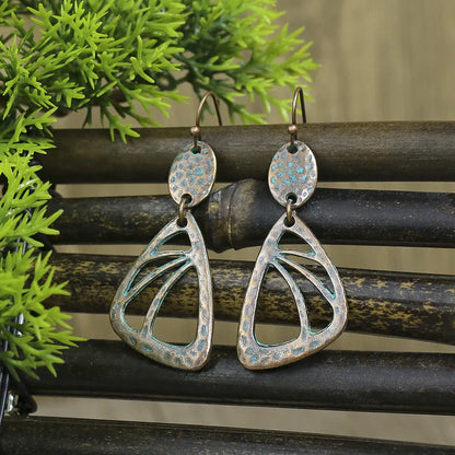 Long oxidised dangle earrings with bohemian abstract design and blue patina - Full view | Zuzu's Trove