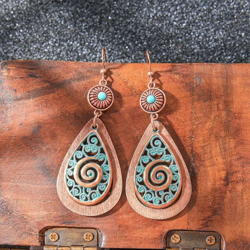 Oxidised blue teal dangle earrings with unique spiral teardrop design and concho top - Front view | Zuzu's Trove