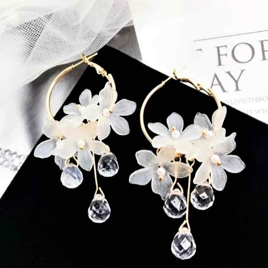 Image of an earring - Korean Earrings - White Flower Hoop Earrings by Zuzus Trove