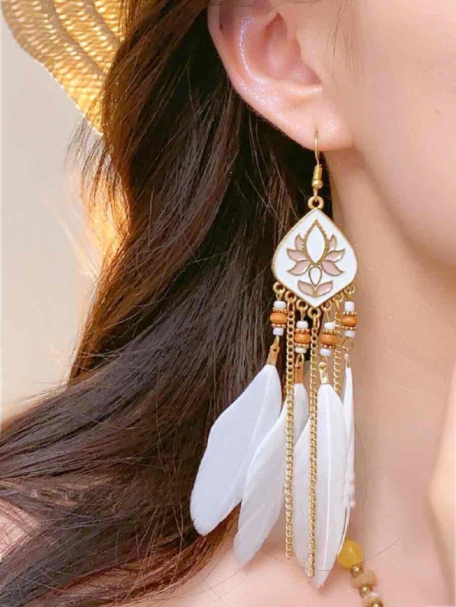 Front view of an earrings - Premium | White Lotus Boho Feather Earrings - Zuzus Trove