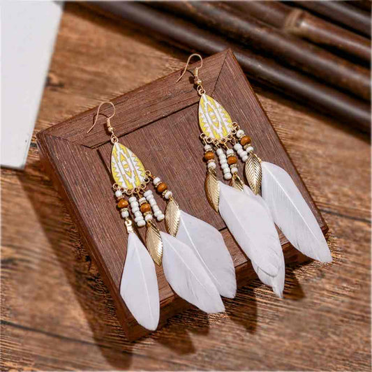 Image of an earring - White Earrings - Beautiful Gold White Feather Earrings by Zuzus Trove